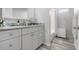 Modern bathroom featuring stylish vanity and fixtures, complemented by natural light, for a relaxing retreat at 915 Citrus Rd, Venice, FL 34293