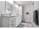 A well-lit bathroom with double vanity, granite countertops, and modern fixtures creating a clean and functional space at 915 Citrus Rd, Venice, FL 34293