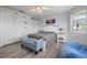 Cozy bedroom features a comfortable bed, blue accent furniture, and ample closet space at 915 Citrus Rd, Venice, FL 34293