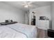 Bedroom with hardwood floors, double bed, and dresser with mounted television at 915 Citrus Rd, Venice, FL 34293