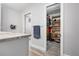 Walk-in closet featuring built-in shelving and storage, with an open doorway at 915 Citrus Rd, Venice, FL 34293