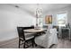 Dining room features unique lighting, plank walls and beverage storage at 915 Citrus Rd, Venice, FL 34293