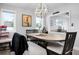 Dining room with a view into the living room with plenty of seating at 915 Citrus Rd, Venice, FL 34293