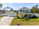 Charming two-story home with a wide front porch, large windows, and well-maintained landscaping at 915 Citrus Rd, Venice, FL 34293