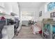 A functional office area with built-in cabinets and desk space, connected to the dining room in an open-concept design at 915 Citrus Rd, Venice, FL 34293