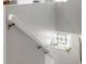 Staircase featuring a decorative window bringing in lots of natural light to this beautiful home at 915 Citrus Rd, Venice, FL 34293