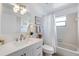 Bright bathroom featuring a vanity, modern fixtures, and a shower-tub combination at 925 Capri Isles Blvd # 4, Venice, FL 34292