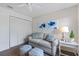 Bedroom showcasing a comfortable seating area, closet and a soothing, neutral color scheme at 925 Capri Isles Blvd # 4, Venice, FL 34292