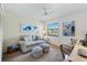Cozy bedroom featuring neutral tones, comfortable seating, and bright natural light at 925 Capri Isles Blvd # 4, Venice, FL 34292