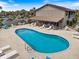 Inviting community pool with lounge seating and shaded gathering space at 925 Capri Isles Blvd # 4, Venice, FL 34292