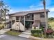 Charming condo complex featuring stone accents, inviting stairs, and well-maintained landscaping at 925 Capri Isles Blvd # 4, Venice, FL 34292