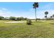 Expansive view of the golf course with green fairways and blue sky at 925 Capri Isles Blvd # 4, Venice, FL 34292
