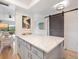 Bright kitchen island with marble countertop and barn door, adjacent to dining area at 925 Capri Isles Blvd # 4, Venice, FL 34292