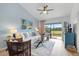 Cozy living room with comfortable seating and a view of the outdoor greenery at 925 Capri Isles Blvd # 4, Venice, FL 34292