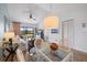 Open concept living area with natural light and a view to a connecting dining area at 925 Capri Isles Blvd # 4, Venice, FL 34292