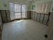 Sunlit bedroom featuring tile floors and bay window at 926 Inlet Cir, Venice, FL 34285