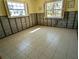 Bedroom with block walls and tile flooring at 926 Inlet Cir, Venice, FL 34285