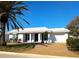 Charming single-story home featuring a well-maintained lawn and a classic white exterior at 926 Inlet Cir, Venice, FL 34285