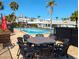Community pool offers a refreshing escape with lounge seating and dining areas at 926 Inlet Cir, Venice, FL 34285