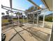 Screened patio with a table and a view of tropical landscaping at 926 Inlet Cir, Venice, FL 34285