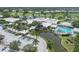 An inviting aerial view of a large community clubhouse with a pool, and a beautiful waterfront view at 934 Wexford Blvd # 934, Venice, FL 34293