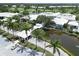 An aerial view shows the clubhouse and surrounding buildings of this well-maintained community at 934 Wexford Blvd # 934, Venice, FL 34293