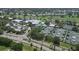 Aerial view of a residential neighborhood featuring roads, houses, and community amenities at 934 Wexford Blvd # 934, Venice, FL 34293