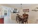 Open-concept dining area with table and chairs, seamlessly connects to the living room and kitchen at 934 Wexford Blvd # 934, Venice, FL 34293