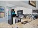 This kitchen features granite countertops, tiled backsplash, stainless steel appliances, and bright white cabinets at 934 Wexford Blvd # 934, Venice, FL 34293