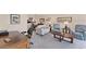 Spacious living room featuring plush seating, and an adjoined dining area and office space at 934 Wexford Blvd # 934, Venice, FL 34293
