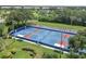 Aerial view of several tennis and pickleball courts at 934 Wexford Blvd # 934, Venice, FL 34293