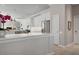 Bright, modern kitchen with white cabinets, stainless steel appliances, and an open layout at 1028 Grouse Way, Venice, FL 34285