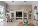 Living room boasts a built-in entertainment center and easy access to the screened lanai at 1028 Grouse Way, Venice, FL 34285