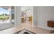 Bright living space showcasing tile flooring, neutral walls, and seamless access to the outdoors at 1028 Grouse Way, Venice, FL 34285