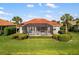 Expansive backyard featuring a screened-in lanai, a serene pool, lush green grass, and tidy landscaping at 109 Montelluna Dr, North Venice, FL 34275