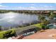 Rooftop aerial view showing the screened lanai, swimming pool and lake view at 109 Montelluna Dr, North Venice, FL 34275