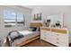 Bright bedroom featuring neutral walls, modern decor, and bright natural light at 109 Montelluna Dr, North Venice, FL 34275
