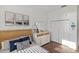 Bright bedroom featuring neutral walls, modern decor, and a closet with bi-fold doors at 109 Montelluna Dr, North Venice, FL 34275