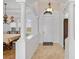 Elegant foyer featuring tiled floors, arched doorways, and views into the dining room at 109 Montelluna Dr, North Venice, FL 34275