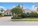 Charming single-story home with a tile roof, well-manicured landscaping, and a brick driveway at 109 Montelluna Dr, North Venice, FL 34275