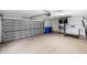 Large garage offering parking and a secondary refrigerator at 109 Montelluna Dr, North Venice, FL 34275