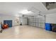Spacious garage with high ceilings, a large door, and ample storage space at 109 Montelluna Dr, North Venice, FL 34275