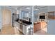 Bright kitchen features stainless steel appliances and granite countertops, open to the living area at 109 Montelluna Dr, North Venice, FL 34275