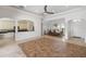 Spacious living room featuring tiled floors and open access to the dining room and kitchen at 109 Montelluna Dr, North Venice, FL 34275