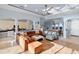 Spacious open-concept living room flowing into kitchen and dining area with lots of natural light at 109 Montelluna Dr, North Venice, FL 34275