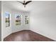 Bright office space with wood floors and multiple windows providing natural light and pleasant views at 109 Montelluna Dr, North Venice, FL 34275