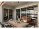 Outdoor patio features patio seating and dining, a ceiling fan, and sliding glass doors to the interior at 109 Montelluna Dr, North Venice, FL 34275