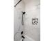 Modern shower with black fixtures, marble tiling, and a decorative niche at 109 Montelluna Dr, North Venice, FL 34275