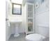 Bathroom featuring a pedestal sink and decorative cabinet for storage at 1100 Tarpon Center Dr # 102B, Venice, FL 34285