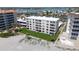 Beautiful condo building with well-maintained grounds, covered parking, and a refreshing pool at 1100 Tarpon Center Dr # 102B, Venice, FL 34285